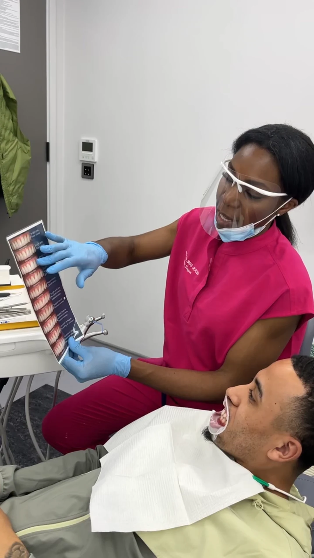 Dr Ogo Eze discussing smile shades with a composite bonding patient