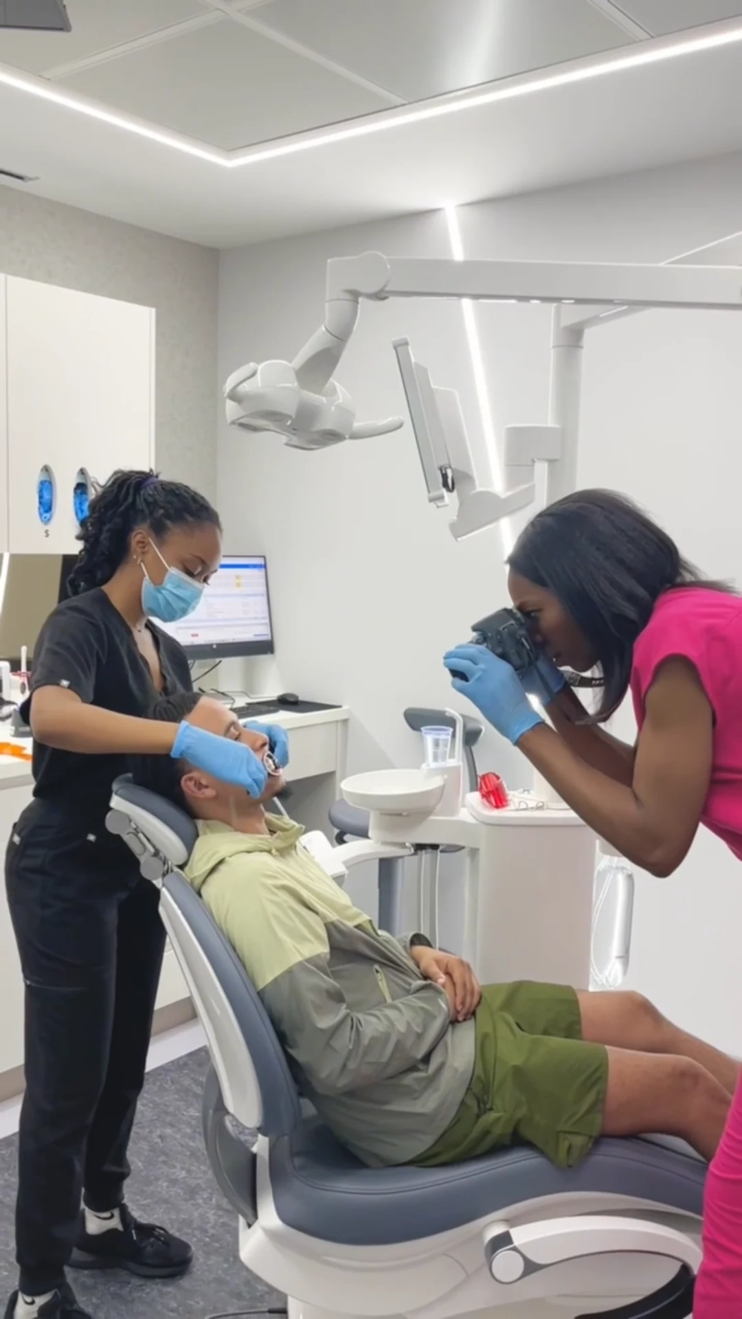 Dr Ogo Eze and the clinical team photographing a patient during an Invisalign assessment